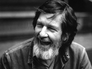 John Cage smiling